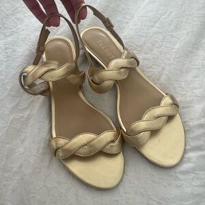 Metallic gold sandals with small wedge. Tags off but never worn.